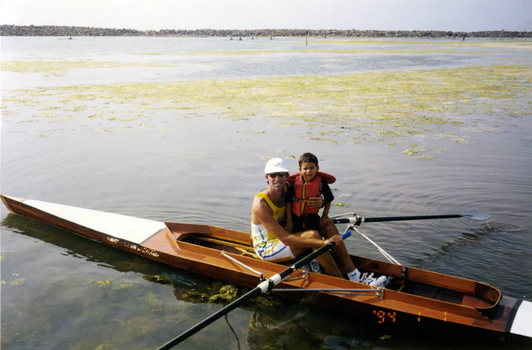 Luis rowing with his son